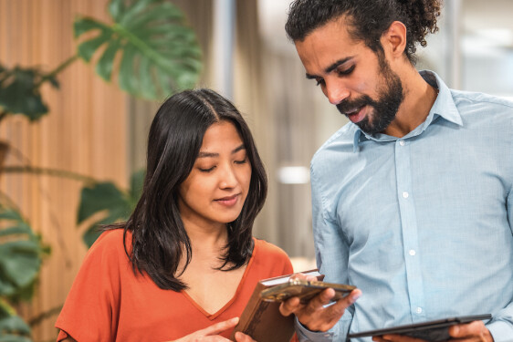 2 people working together